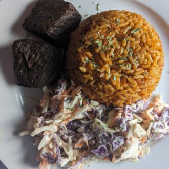 FRIED BEEF JOLLOF RICE WITH COLESLAW