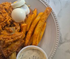JOLLOF RICE, TURKEY, BOILED EGG, FRIES WITH LEMON AND BASIL DIPPING