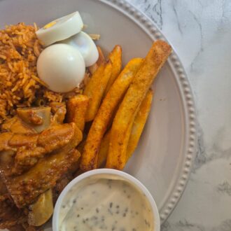JOLLOF RICE TURKEY BOILED EGG FRIES WITH LEMON AND BASIL DIPPING